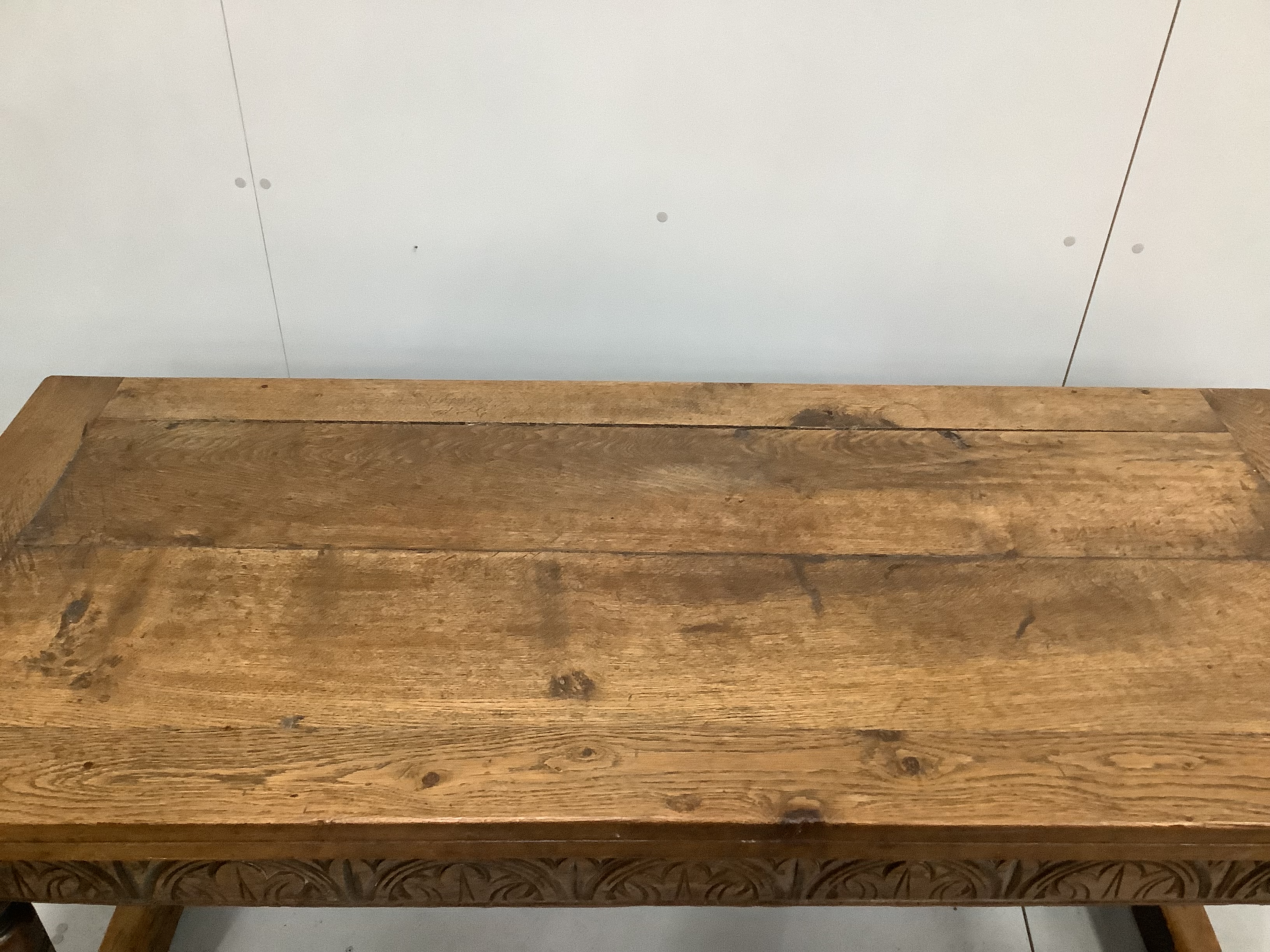 A 17th century style rectangular oak refectory dining table, incorporates old timber, width 168cm, depth 73cm, height 73cm